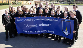 Children of King Arthur's holding an Ofsted banner, accompanied by David Heath MP